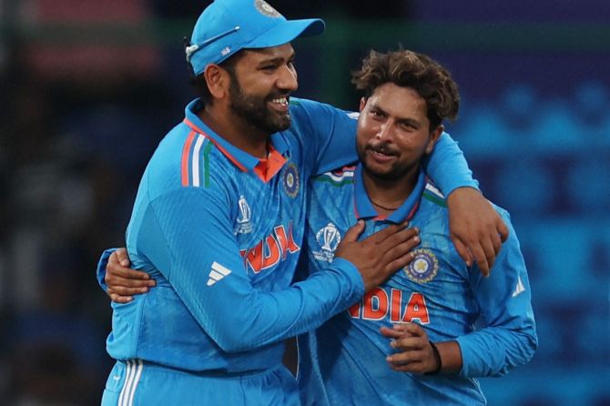 India's Kuldeep Yadav celebrates with Rohit Sharma after taking the wicket of Afghanistan's Hashmatullah Shahidi LBW
