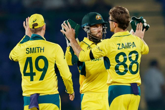 Australia's Adam Zampa celebrates after taking the wicket of Netherlands' Logan van Beek, caught by Josh Inglis
