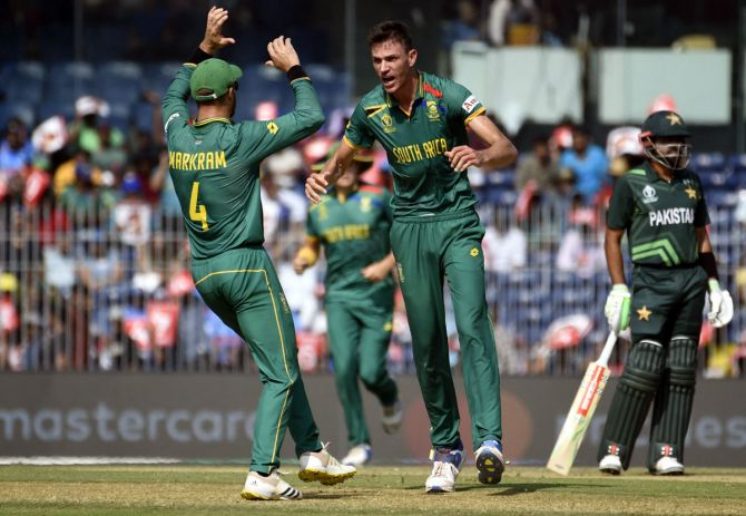 Marco Jansen celebrates with Aiden Markram after taking the wicket of Imam-ul-Haq.