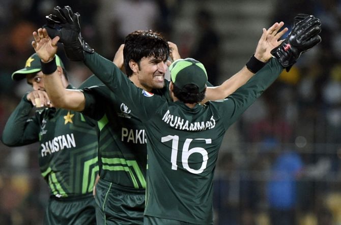 Mohammad Wasim Jr. celebrates with his Pakistan teammates after dismissing Temba Bavuma.