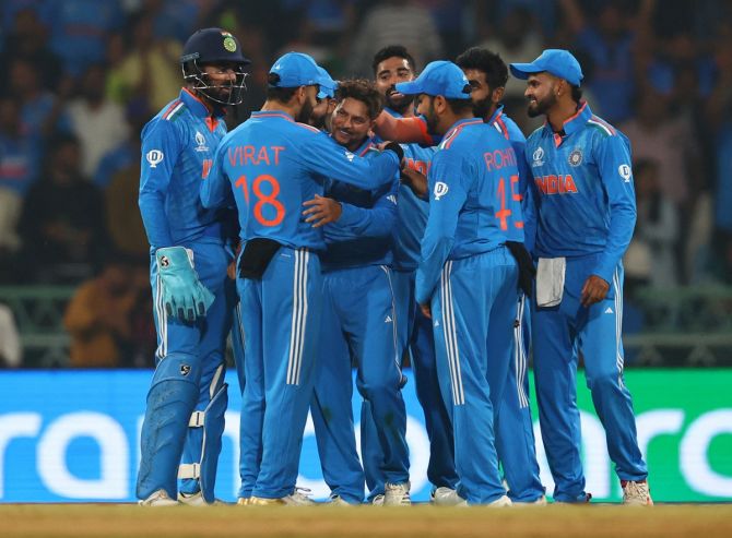 Kuldeep Yadav celebrates with his India teammates after dismissing England's Jos Buttler with a peach of delivery during the ICC World Cup match at Ekana Cricket Stadium, Lucknow, on Sunday.