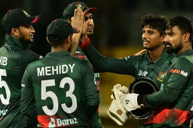 Bangladesh players celebrate after beating India by 6 runs
