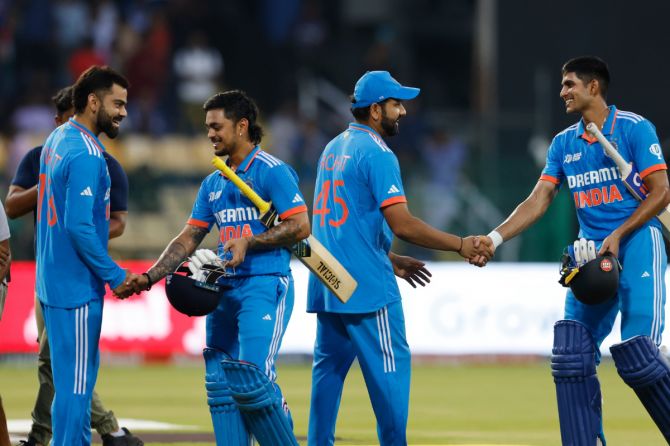 India openers Shubman Gill and Ishan Kishan celebrate with Virat Kohli and Rohit Sharma after their win