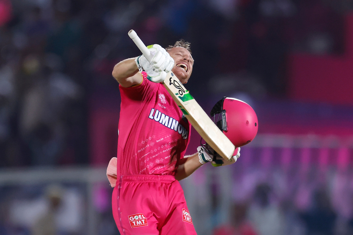 Rajasthan Royals opener Jos Buttler celebrates completing 100 during the IPL match against Royal Challengers Bangalore, at the Sawai Mansingh Stadium, in Jaipur, on Saturday.