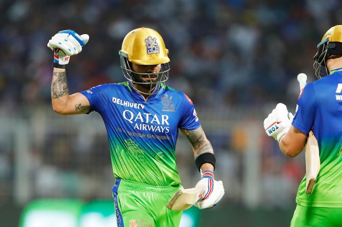 Virat Kohli walks back disappointed after being caught and bowled by Harshit Rana after a controversial delivery