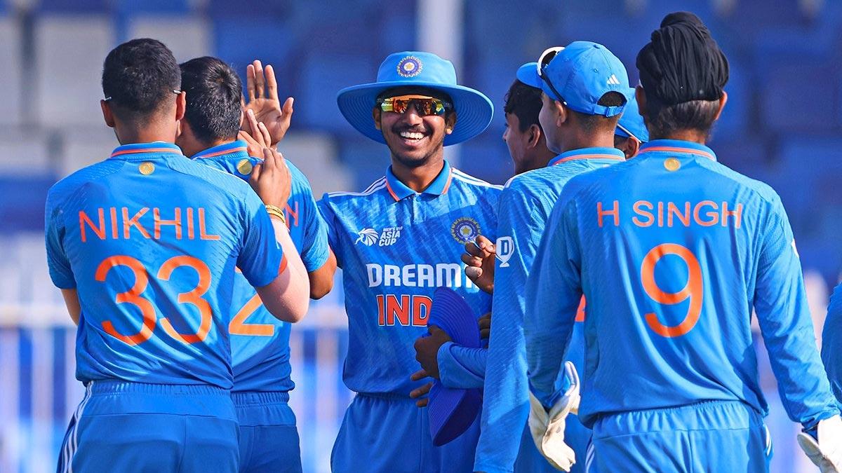 India Under-19 players celebrate a wicket.