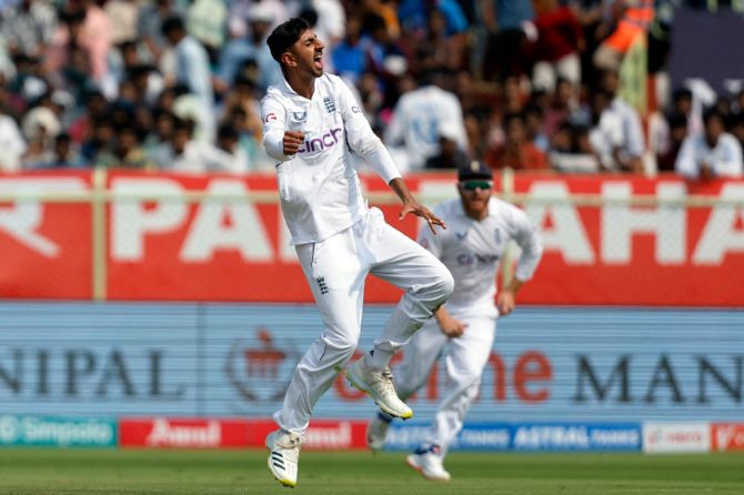 England's Shoaib Bashir celebrates after taking the wicket of India's Rohit Sharma, caught out by Ollie Pope