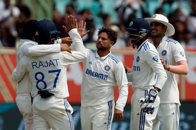 Kuldeep Yadav celebrates with teammates after Rajat Patidar took a catch to dismiss England's Ben Duckett 