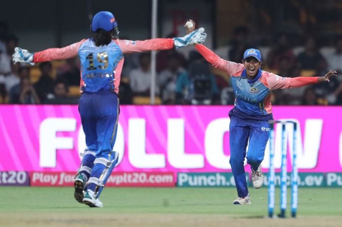 Mumbai Indians'Sathyamoorthy Keerthana and Yastika Bhatia celebrate the wicket of Gujarat Giants Phoebe Litchfield 