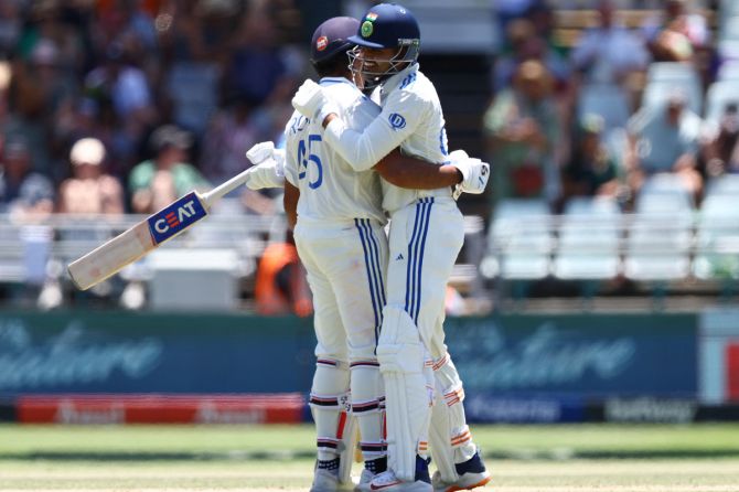 India's Shreyas Iyer and Rohit Sharma celebrate on scoring the winning runs to claim the 2nd Test match at Newlands Cricket Ground, Cape Town, South Africa, on Thursday