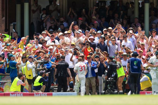 David Warner walks off the pitch for the final time in Test cricket on Saturday