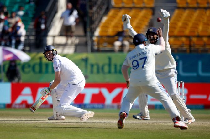 India's Sarfaraz Khan celebrates with Dhruv Jurel after taking the catch to dismiss England's Zak Crawley off the bowling of Ravichandran Ashwin