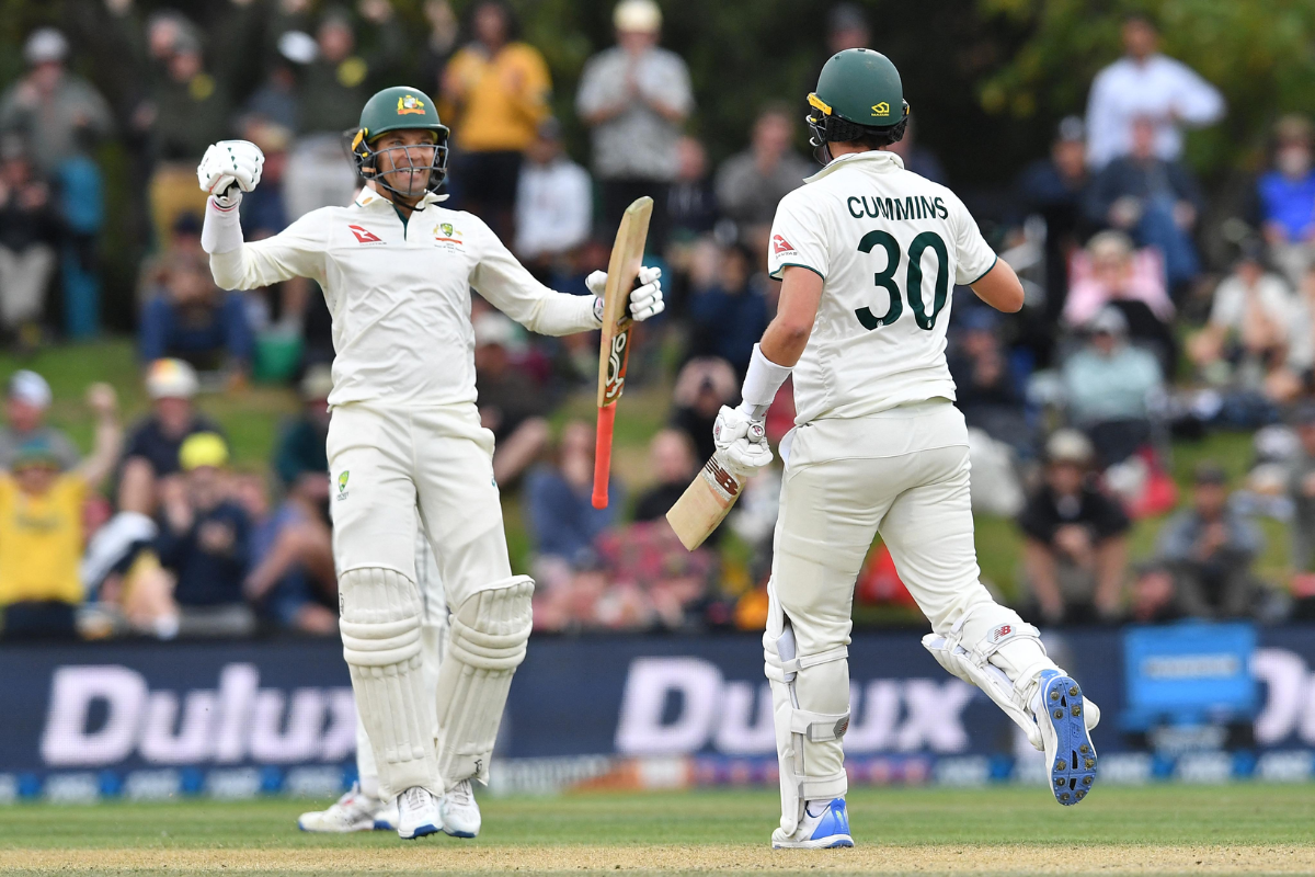Australia's Alex Carey and Pat Cummins celebrate on scoring the winning runs in the 2nd Test against New Zealand on Monday