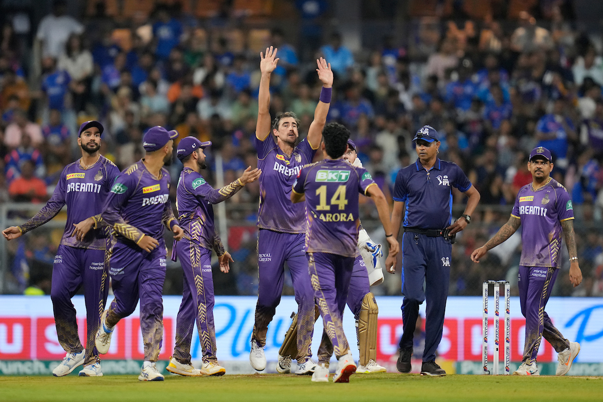 Kolkata Knight Riders pacer Mitchell Starc celebrates with teammates after dismissing Ishan Kishan during the IPL match against Mumbai Indians in Mumbai on Friday. 