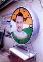 Ajit Pawar smiles through the party symbol