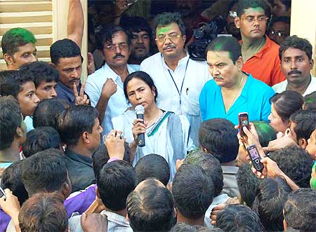 Mamata Banerjee in front of her residence in Kolkata