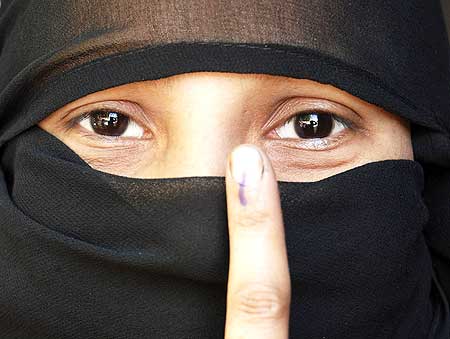 A Muslim voter in Mathura, Uttar Pradesh, shows off her voting mark, May 7