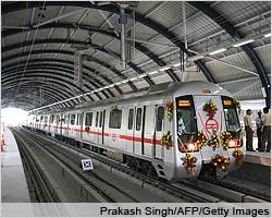 A Delhi metro train waits at the Indraprastha station platform