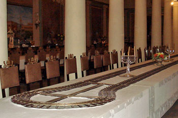 Miniature tracks on the long banquet table for the wine train