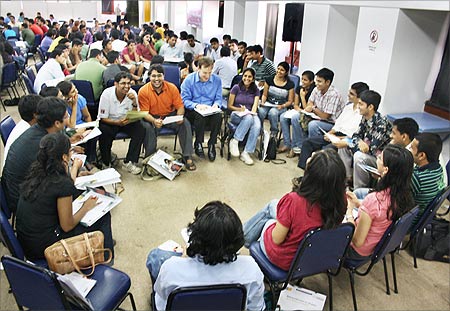 US-bound students listen to a presentation