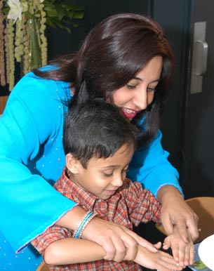 Monica Bhide with son Jai, making sushi