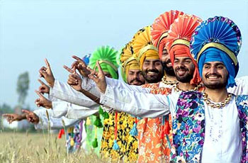 Farmers perform the Bhangra, a traditional Punjabi dance, on the eve of the Baisakhi festival.