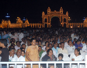 People watching a cultural programme at the palace premises.