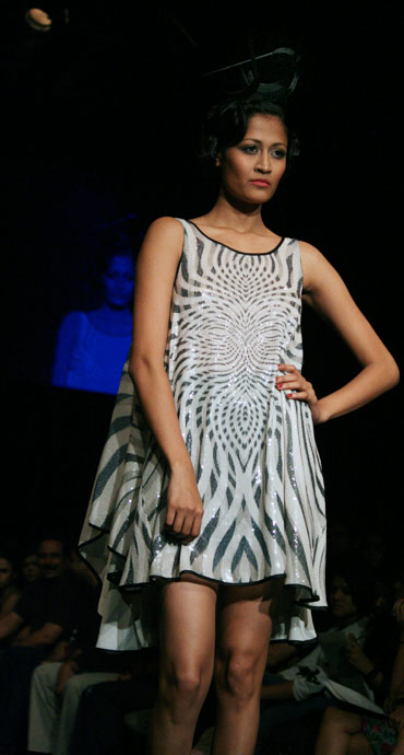 A model showcases a creation by Ritu Kumar