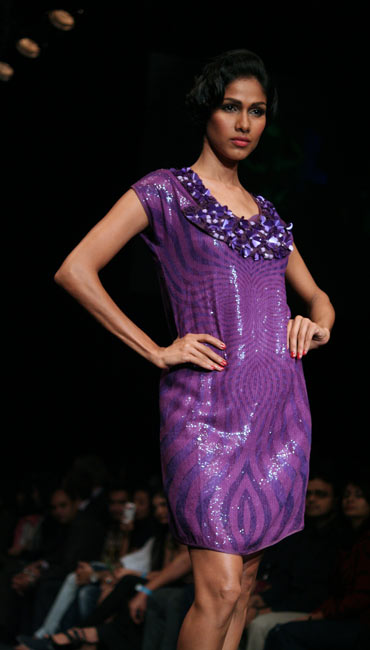 A model showcases a creation by Ritu Kumar