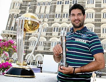 Yuvraj Singh of the Indian cricket team poses with the ICC Cricket World Cup Trophy