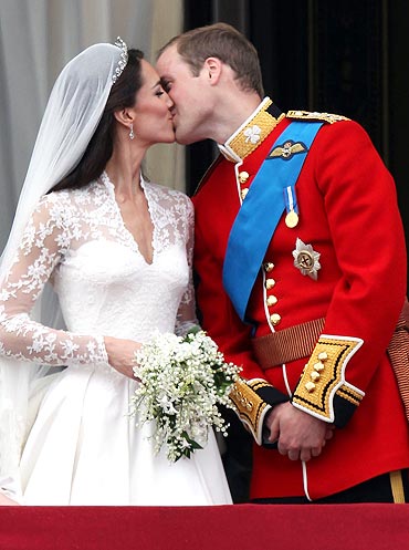 Their Royal Highnesses Prince William, Duke of Cambridge and Catherine, Duchess of Cambridge kiss on the balcony at Buckingham Palace on April 29, 2011 in London, England