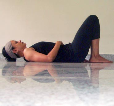 to  as bent, One knees  yoga shown, pressure ie high blood close hips. on poses feet flat, for with back