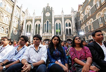 Students listen to US President Barack Obama during a town hall meeting at St. Xavier's College in Mumbai