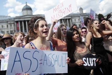 SlutWalk participants cheer a speaker in Trafalgar Square, central London, June 11, 2011