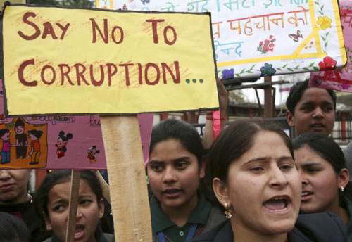 School students shout slogans during a protest against corruption