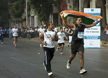 A marathon runner waving the Indian tricolour for inspiration