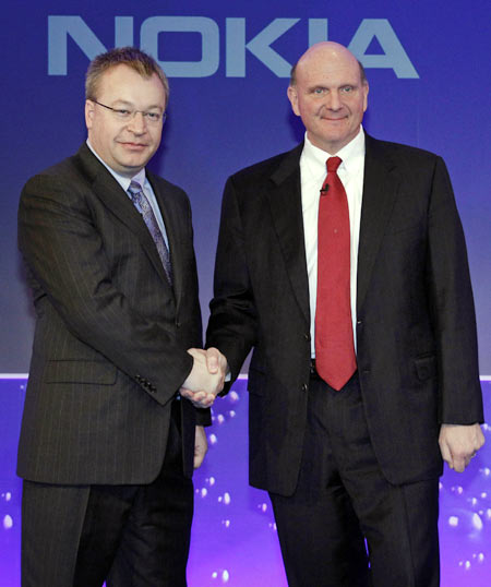 Nokia chief executive Stephen Elop (L) welcomes Microsoft chief executive Steve Ballmer with a handshake at a Nokia event in London February 11, 2011. Nokia and Microsoft teamed up to build an iPhone killer on Friday in a desperate attempt to take on Google and Apple in the fast-growing smartphone market.