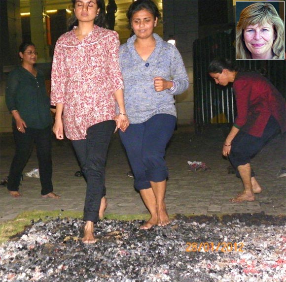 Participants walking on fire; Inset: Peggy Dylan