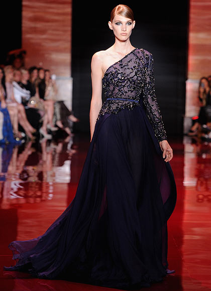 A model walks the runway during the Elie Saab show as part of Paris Fashion Week Haute-Couture Fall/Winter 2013-2014 at Palais Brongniart on July 3, 2013 in Paris, France