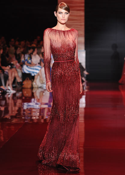 A model walks the runway during the Elie Saab show as part of Paris Fashion Week Haute-Couture Fall/Winter 2013-2014 at Palais Brongniart on July 3, 2013 in Paris, France