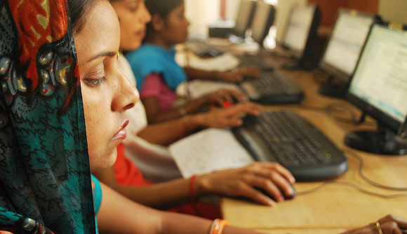 Women working at the Source for Change BPO