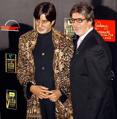 Amitabh Bachchan (right) poses beside his wax statue at Madame Tussaud's, London