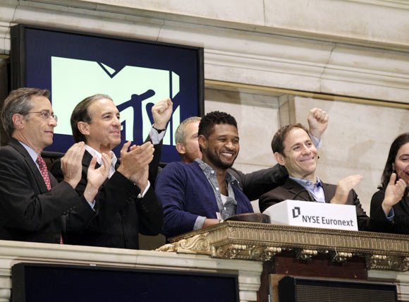Lawrence Leibowitz, NYSE Euronext Managing Director and Chief Operating Officer, Van Toffler, president of MTV Networks Music & Logo Group, Singer Usher and Stephen Friedman, president of MTV, ring the opening bell at the New York Stock Exchange in honor of MTV's 30th birthday in New York.