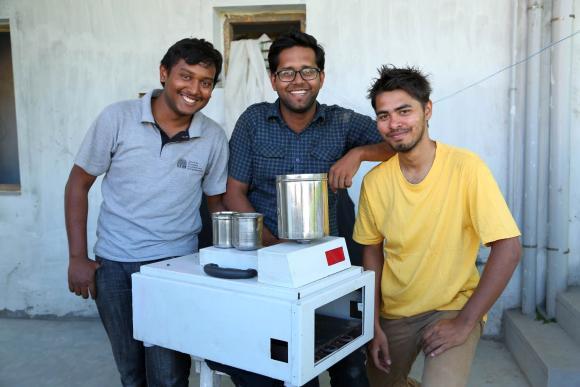 Eeshwar K Vikas, Sudeep Sabat and Sudarshan Lodha with their dosa machine