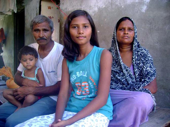 Sushma with her parents and sister Ananya at her Lucknow home