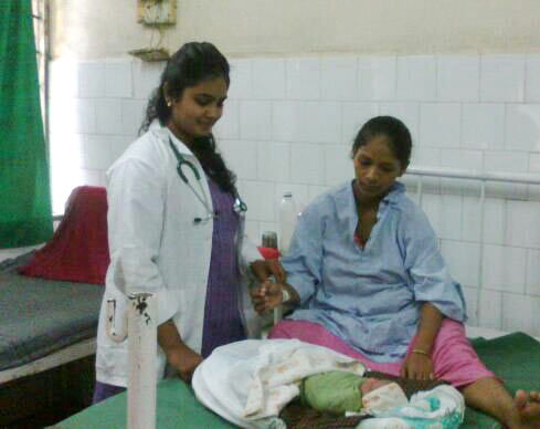Dr Iyer attends a patient in the maternity ward at the government hospital in Jogeshwari