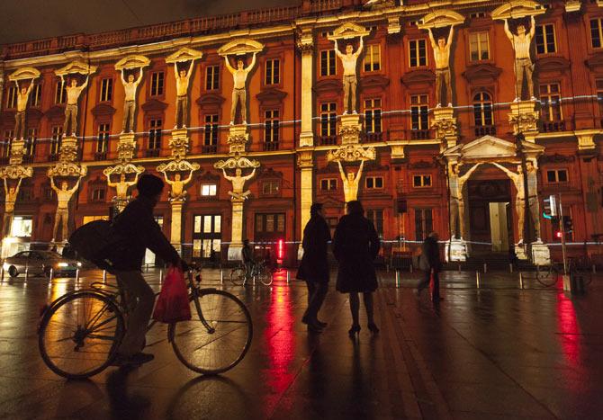 An illuminated facade of a building during the Festival of Lights in Lyon, France