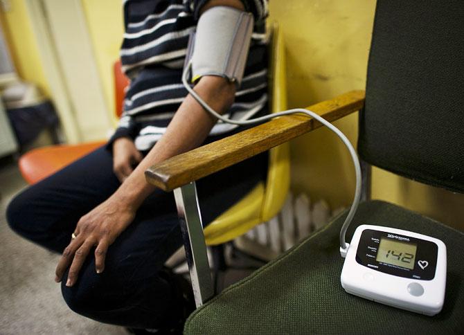 According to Jain, 35 per cent of people who suffer from high blood pressure don't even know it. Seen here is a patient getting her blood pressure checked at a clinic.