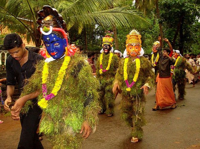 'In Kerala, Kummatis travel in groups and perform the Kummatikali -- a form of dance where they hop and jump in a synchronised pattern to entertain children. Some times they enact scenes from the Ramayana and Mahabharata, share lessons in peace and happiness.' Photograph: Aruna/Wikimedia Commons. Image published only for representational purposes.