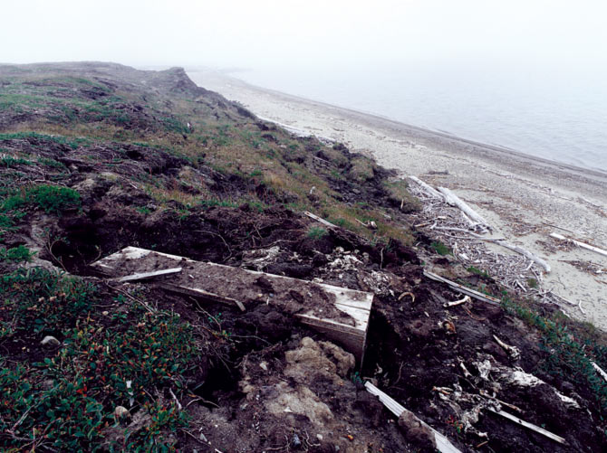 An exposed coffin, Barter Island, August 2006. Subhankar Banerjee's friend from Kaktovik told him that the permafrost around the coffin -- of a 19th century New England whaler -- had melted away (a climate change phenomenon).